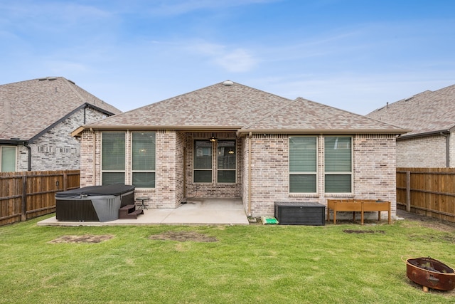 1529 Calcot Ln, Forney, TX 75126 - back of house featuring a hot tub, brick siding, a patio area, and an outdoor fire pit