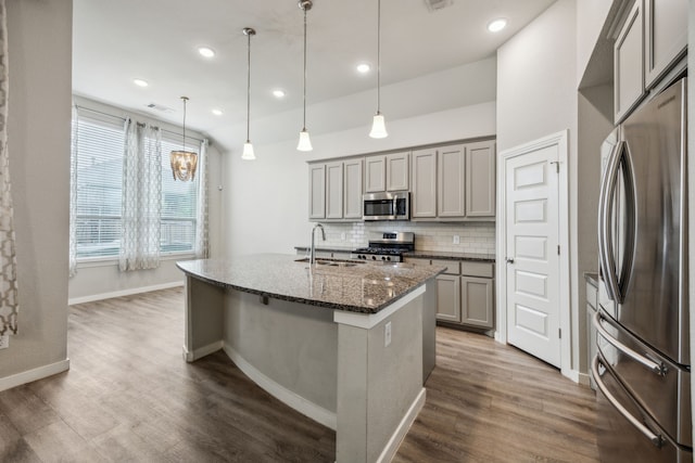 1529 Calcot Ln, Forney, TX 75126 - kitchen featuring stainless steel appliances, gray cabinets, dark stone counters, tasteful backsplash, and dark wood-style flooring