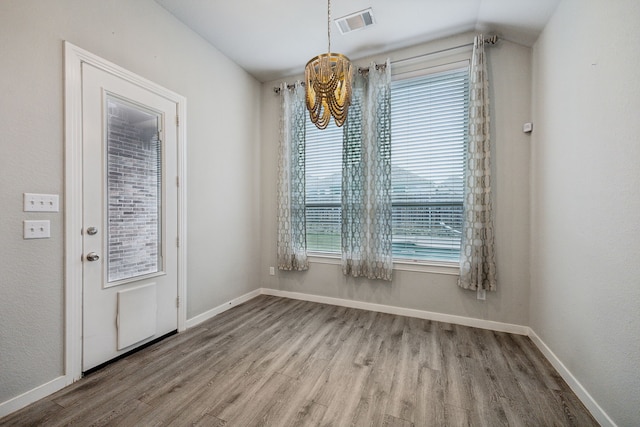 1529 Calcot Ln, Forney, TX 75126 - unfurnished dining area featuring wood finished floors, baseboards, and lofted ceiling
