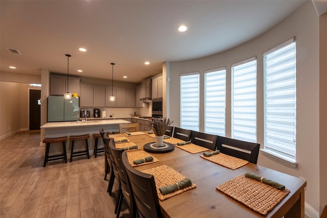 3036 Lionsgate Dr, Argyle, TX 76226 - dining space featuring healthy amount of natural light, light wood-style floors, baseboards, and recessed lighting