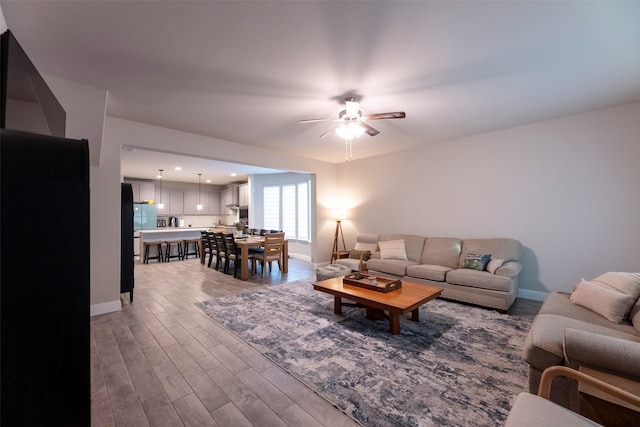 3036 Lionsgate Dr, Argyle, TX 76226 - living area with a ceiling fan, baseboards, and wood finished floors