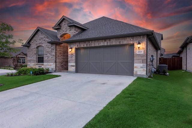 3036 Lionsgate Dr, Argyle, TX 76226 - french country style house with an attached garage, driveway, roof with shingles, brick siding, and central AC unit