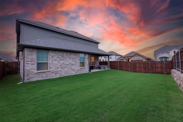 3036 Lionsgate Dr, Argyle, TX 76226 - back of property at dusk featuring a patio area, brick siding, and a shingled roof