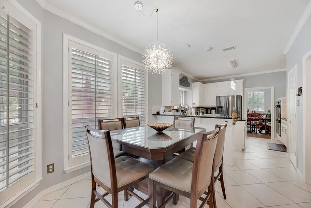 2805 Pine View Dr, Grapevine, TX 76051 - dining area with a chandelier, light tile patterned floors, ornamental molding, and baseboards