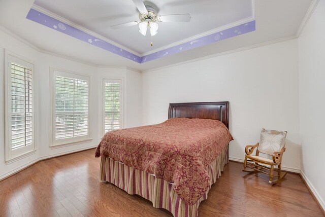 2805 Pine View Dr, Grapevine, TX 76051 - bedroom with a raised ceiling, wood finished floors, crown molding, and ceiling fan