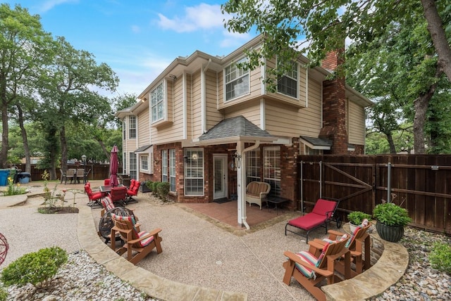 2805 Pine View Dr, Grapevine, TX 76051 - back of house featuring a chimney, brick siding, a patio area, and a fenced backyard