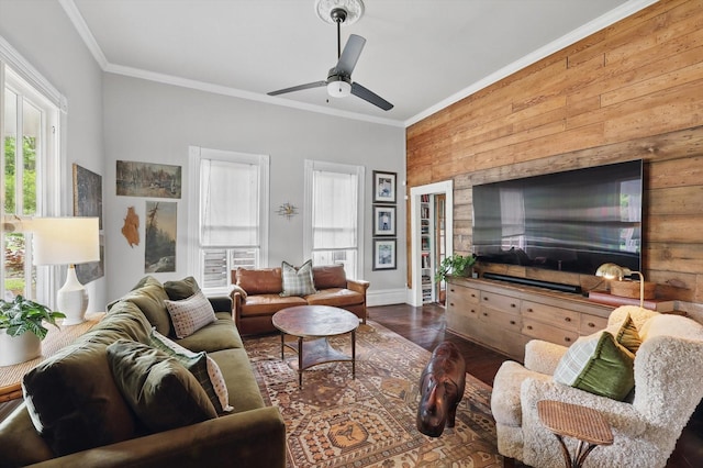 505 N College St, Mckinney, TX 75069 - living room with wood walls, crown molding, a ceiling fan, wood finished floors, and baseboards