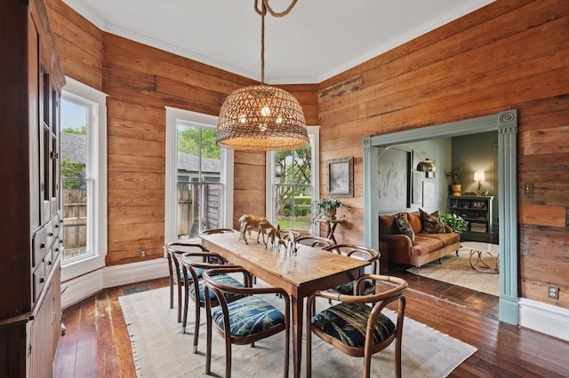 505 N College St, Mckinney, TX 75069 - dining space featuring wood walls and wood-type flooring