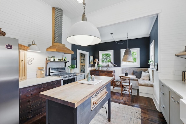505 N College St, Mckinney, TX 75069 - kitchen featuring appliances with stainless steel finishes, wooden counters, a center island, dark wood-style floors, and open shelves