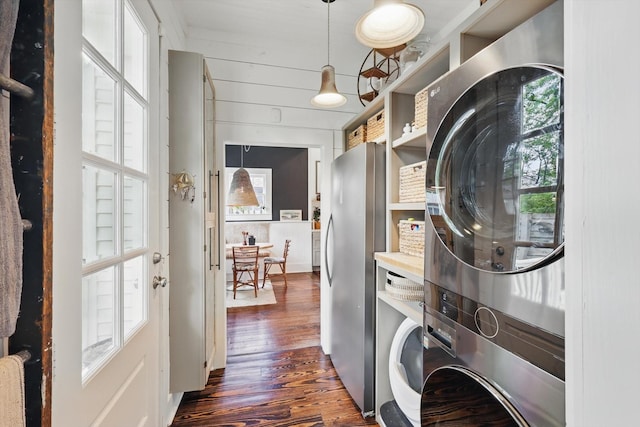 505 N College St, Mckinney, TX 75069 - laundry room featuring stacked washing machine and dryer and dark wood finished floors