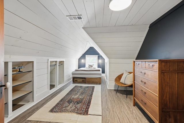 505 N College St, Mckinney, TX 75069 - bedroom with wood ceiling, lofted ceiling, light wood-style floors, and wooden walls