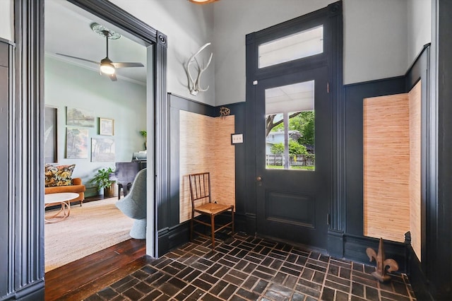 505 N College St, Mckinney, TX 75069 - entryway featuring brick flooring, a ceiling fan, and ornamental molding