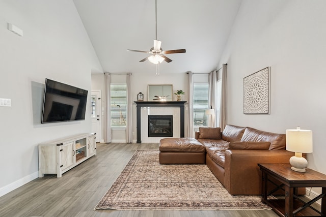 1601 Stetson St, Northlake, TX 76247 - living area with a ceiling fan, light wood finished floors, a fireplace, vaulted ceiling, and baseboards