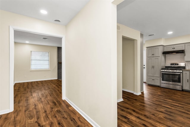 2302 Mockingbird Ln, Garland, TX 75042 - hallway featuring dark wood-style floors and baseboards