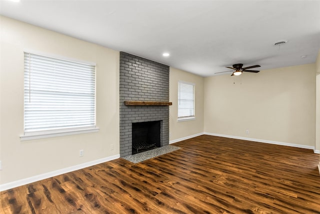 2302 Mockingbird Ln, Garland, TX 75042 - unfurnished living room featuring a ceiling fan, wood finished floors, a fireplace, baseboards, and recessed lighting