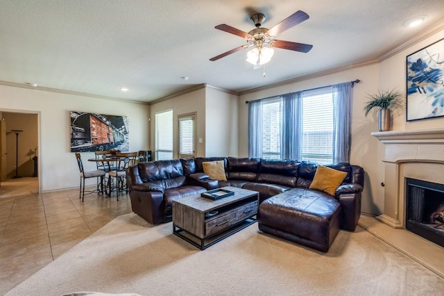 6620 Friendsway Dr, Fort Worth, TX 76137 - living area featuring ornamental molding, plenty of natural light, a fireplace with raised hearth, a ceiling fan, and recessed lighting