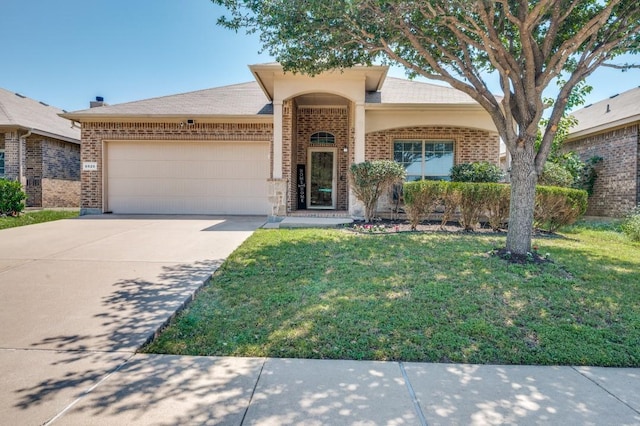6620 Friendsway Dr, Fort Worth, TX 76137 - view of front facade with brick siding, an attached garage, concrete driveway, and a front yard