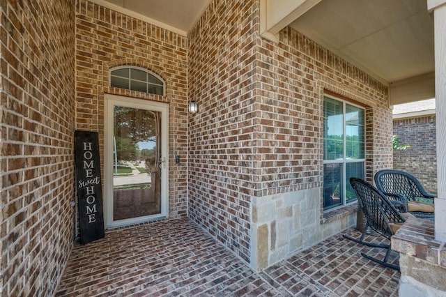 6620 Friendsway Dr, Fort Worth, TX 76137 - doorway to property featuring brick siding and covered porch