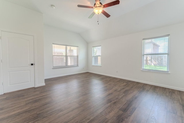2025 Scott Creek Dr, Little Elm, TX 75068 - empty room featuring lofted ceiling, dark wood-style flooring, ceiling fan, baseboards, and a smoke detector