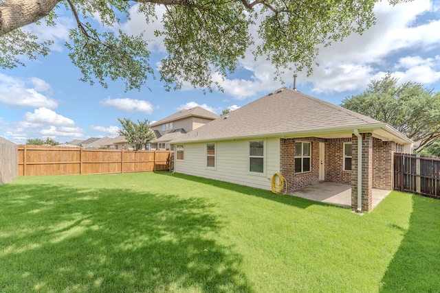 2025 Scott Creek Dr, Little Elm, TX 75068 - back of property featuring a patio, brick siding, and a shingled roof