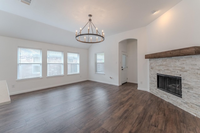 2025 Scott Creek Dr, Little Elm, TX 75068 - unfurnished living room featuring dark wood-style flooring, a fireplace, a chandelier, arched walkways, and baseboards