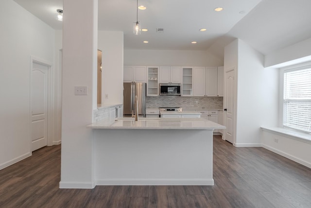 2025 Scott Creek Dr, Little Elm, TX 75068 - kitchen with appliances with stainless steel finishes, open shelves, white cabinetry, dark wood-style flooring, and backsplash