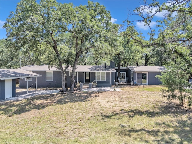 2141 Midway Rd, Flower Mound, TX 75022 - rear view of house with a yard, a porch, and a chimney
