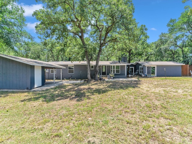 2141 Midway Rd, Flower Mound, TX 75022 - rear view of house with a lawn and a chimney