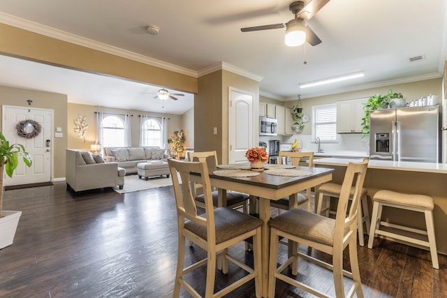8713 Trinity Vista Trl, Fort Worth, TX 76053 - dining room with a ceiling fan, crown molding, dark wood finished floors, and baseboards