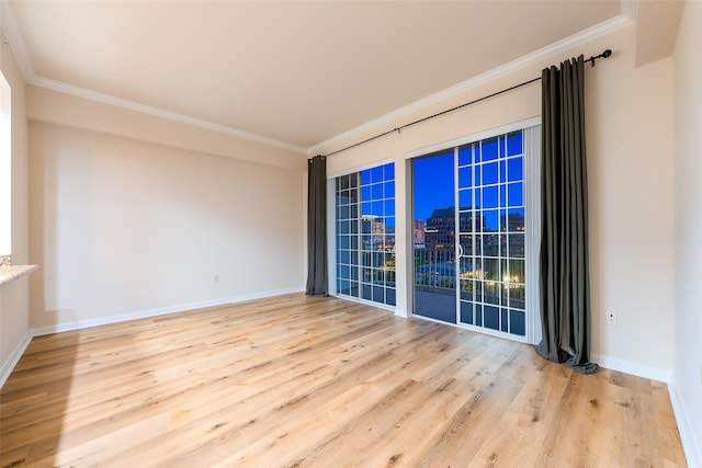 3225 Turtle Creek Blvd Unit 1012, Dallas, TX 75219 - spare room with wood finished floors, crown molding, baseboards, and a city view