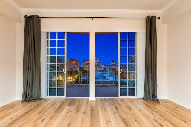 3225 Turtle Creek Blvd Unit 1012, Dallas, TX 75219 - unfurnished room with wood finished floors, ornamental molding, and baseboards