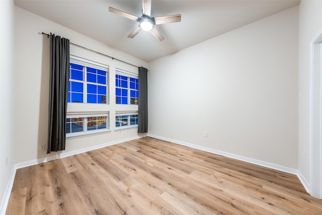 3225 Turtle Creek Blvd Unit 1012, Dallas, TX 75219 - spare room featuring wood finished floors, baseboards, and ceiling fan