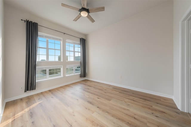 3225 Turtle Creek Blvd Unit 1012, Dallas, TX 75219 - unfurnished room with light wood-style flooring, baseboards, and a ceiling fan