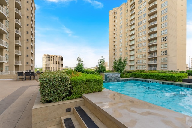 3225 Turtle Creek Blvd Unit 1012, Dallas, TX 75219 - community pool featuring a patio area