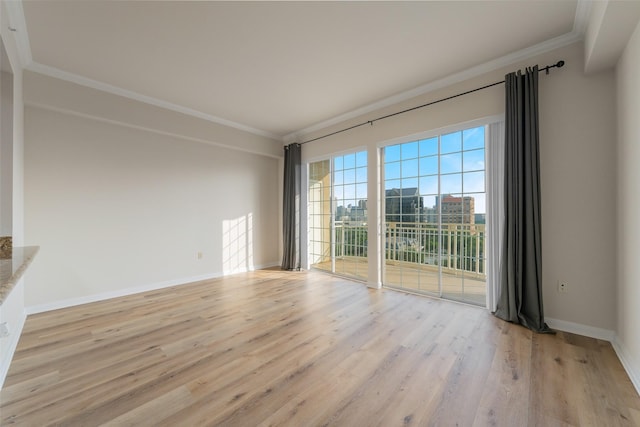 3225 Turtle Creek Blvd Unit 1012, Dallas, TX 75219 - unfurnished room featuring ornamental molding, light wood finished floors, and baseboards