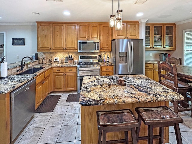 434 Thornton Ln, Palo Pinto, TX 76484 - kitchen featuring stainless steel appliances, ornamental molding, a sink, light stone counters, and decorative backsplash