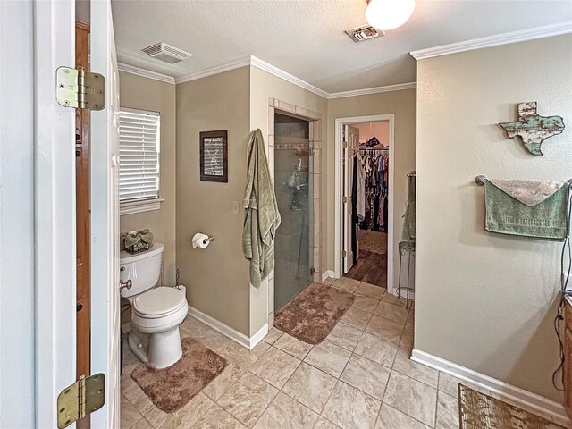434 Thornton Ln, Palo Pinto, TX 76484 - full bathroom featuring a stall shower, a spacious closet, ornamental molding, baseboards, and toilet