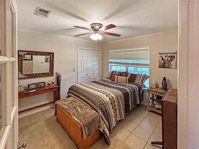 434 Thornton Ln, Palo Pinto, TX 76484 - bedroom with light tile patterned floors, ornamental molding, ceiling fan, and a closet