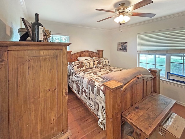 434 Thornton Ln, Palo Pinto, TX 76484 - bedroom featuring wood finished floors, ornamental molding, multiple windows, and a ceiling fan