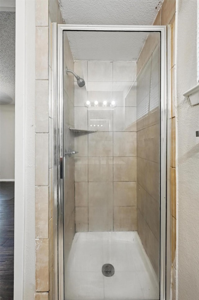 815 Quail Ter, Mansfield, TX 76063 - bathroom with a textured ceiling and a shower stall