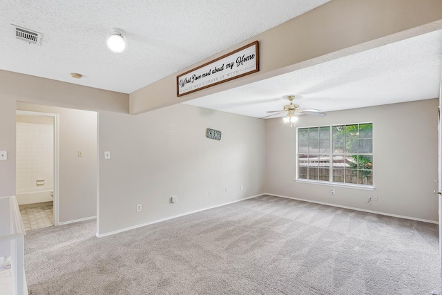 1019 W Lovers Ln W, Arlington, TX 76013 - carpeted spare room featuring a ceiling fan, a textured ceiling, baseboards, and a smoke detector