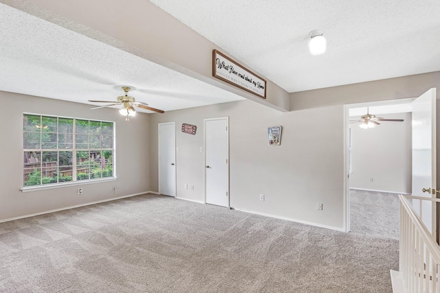 1019 W Lovers Ln W, Arlington, TX 76013 - carpeted empty room with ceiling fan, a textured ceiling, and baseboards