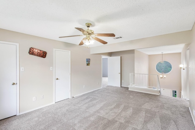 1019 W Lovers Ln W, Arlington, TX 76013 - unfurnished room with carpet, a ceiling fan, a textured ceiling, and baseboards