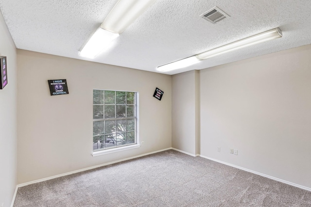 1019 W Lovers Ln W, Arlington, TX 76013 - empty room with a textured ceiling, carpet flooring, and baseboards