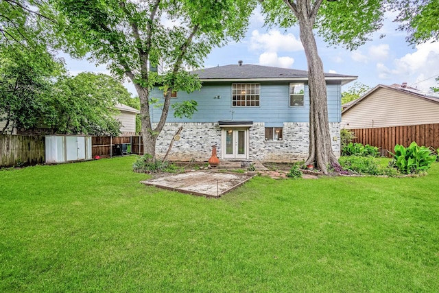 1019 W Lovers Ln W, Arlington, TX 76013 - back of property featuring brick siding, a patio area, and french doors