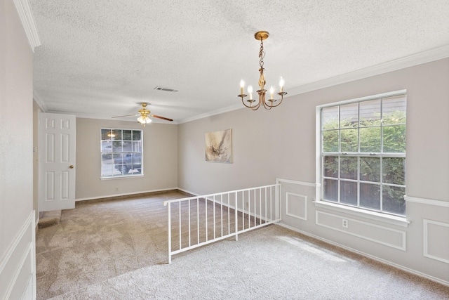 1019 W Lovers Ln W, Arlington, TX 76013 - unfurnished room with crown molding, carpet floors, a textured ceiling, ceiling fan, and a chandelier