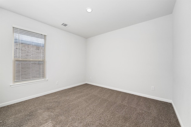 9653 Alderleaf Trl, Fort Worth, TX 76036 - spare room featuring dark carpet and baseboards