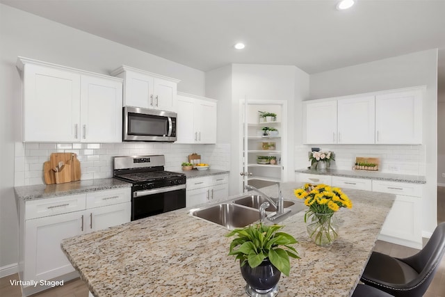 9653 Alderleaf Trl, Fort Worth, TX 76036 - kitchen featuring stainless steel appliances, a sink, white cabinetry, and recessed lighting