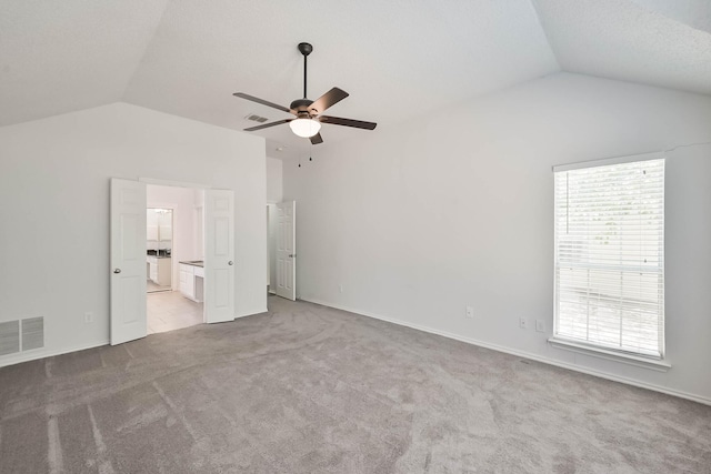 7405 Mesa Verde Trl, Fort Worth, TX 76137 - unfurnished bedroom with lofted ceiling, light carpet, ensuite bathroom, and a ceiling fan