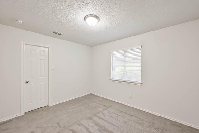 7405 Mesa Verde Trl, Fort Worth, TX 76137 - unfurnished room with carpet flooring, a textured ceiling, a smoke detector, and baseboards